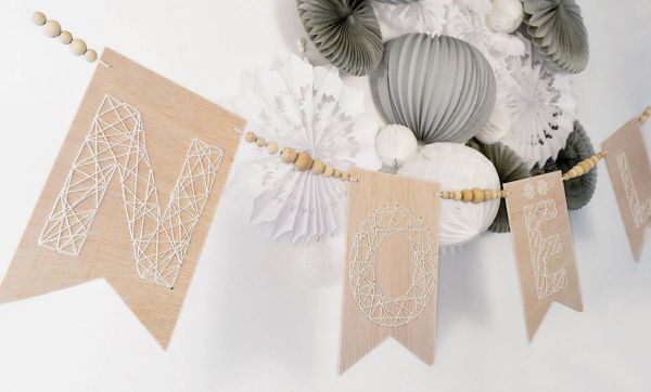 DIY : Fabriquez une guirlande de Noël en bois brodé