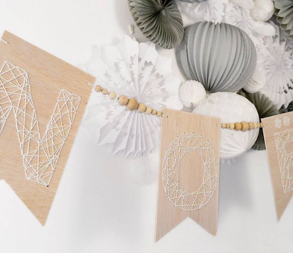 DIY : Fabriquez une guirlande de Noël en bois brodé