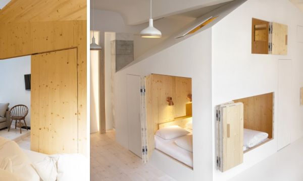 Cette mini-maison, posée au milieu d'une chambre, se referme comme une boîte